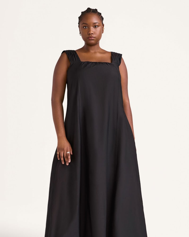 Front of a model wearing a size XL Rossetti Dress in Black by Merlette. | dia_product_style_image_id:319737